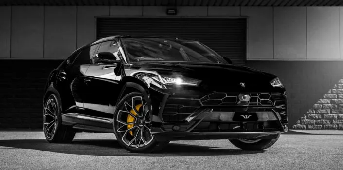 full frontal view black urus with tuning