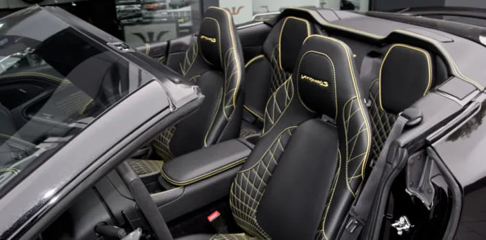 leather stitching aston martin black yellow volante