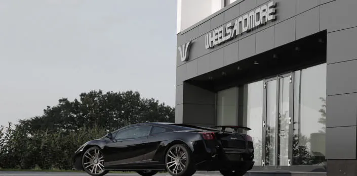 rear view of black superleggera with 20 inch concave fiwe wheels