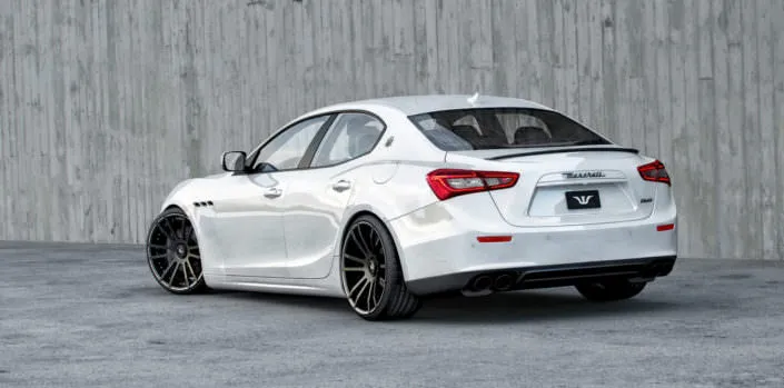 white ghibli rear seide view with 22 inch fiwe wheels and lowering suspension