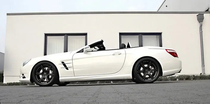 white sl350 mercedes wearing 6sporz wheels in matte black