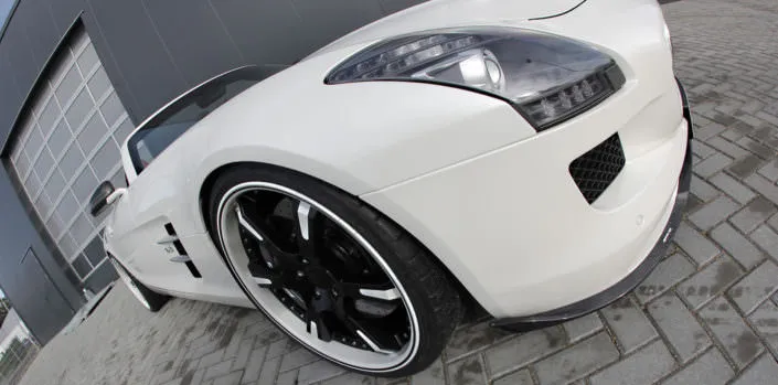 white sls amg front side view with 21inch 6sporz wheels with individual finish black and white