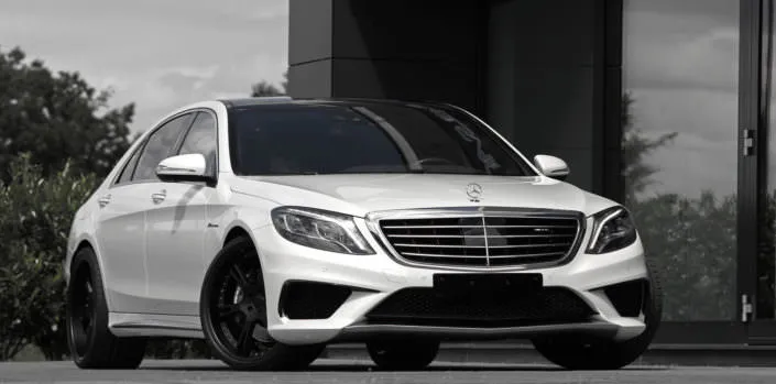 white s63 sedan wearing 22 inch 6sporz wheels in black