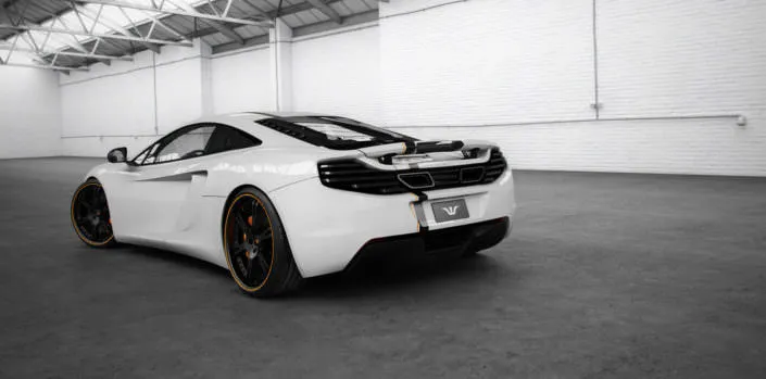 McLaren-MP4-12C-Tuning rear side view of mclaren mp4-12c with wheels and exhaust
